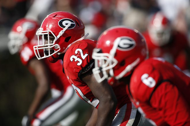 Georgia linebackers Monty Rice (32) and Natrez Patrick (6) get set for a play during the annual G-Day Game on April 21 in Athens. [JOSHUA L. JONES/ATHENS BANNER-HERALD]