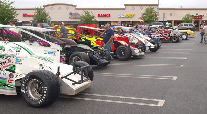 Drivers from the Orange County Fair Speedway gathered with their cars in the parking lot of the Subway on Route 211 in Middletown on June 27. It was a gathering and meet and greet organized by Roger Henion Jr., who races a 385 modified. [DONNA KESSLER/Times Herald-Record]