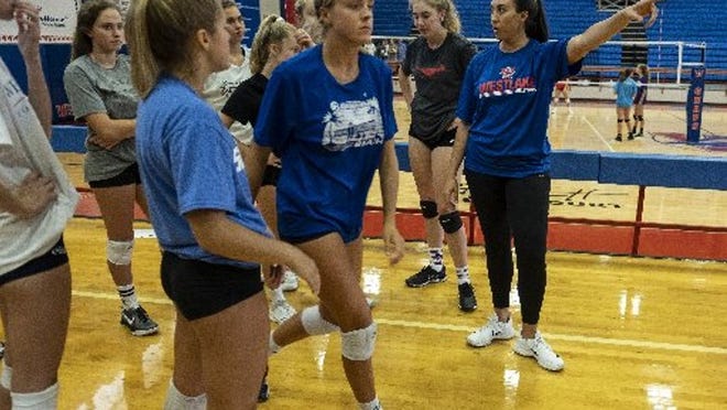 Westlake’s new volleyball head coach, Marci Laracuente, directs the varsity squad in drills during team tryouts held at Westlake high school in Austin, Texas, on Thursday, Aug. 2, 2018. Laracuente from Flower Mound will take over the program after the team’s long term coach, Al Bennett, retired. (Rodolfo Gonzalez / for Austin American-Statesman)