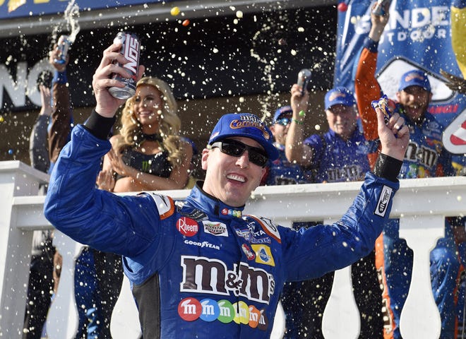 Kyle Busch celebrates in Victory Lane after winning a NASCAR Cup Series auto race July 29 in Long Pond, Pa. [AP Photo/Derik Hamilton]