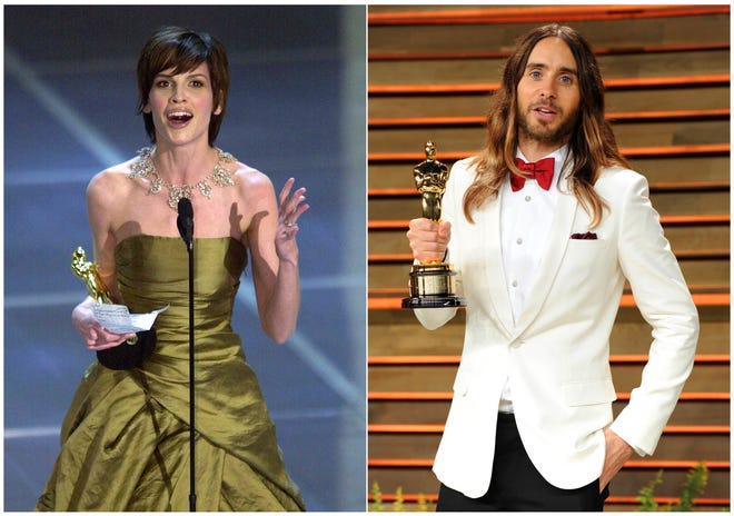 In this combination photo, Hilary Swank accepts the Oscar for best actress for her role in "Boys Don't Cry" during the 72nd Academy Awards in Los Angeles on March 26, 2000, left, and Jared Leto poses with his Oscar for best supporting actor for "Dallas Buyer Club" at the 2014 Vanity Fair Oscar Party in West Hollywood, Calif., on March 2, 2014. Swank and Leto portrayed transgender characters. (AP Photo)