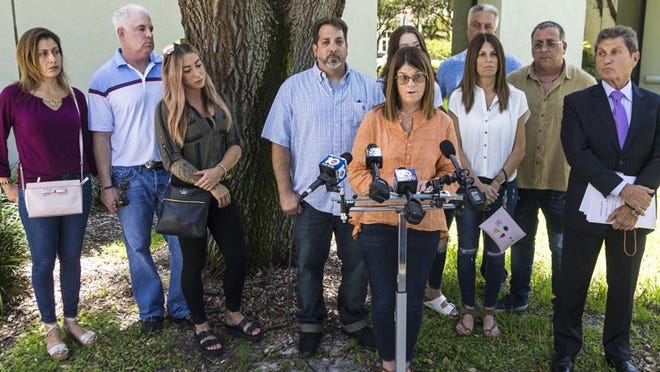 Jodi Bruce, sister of Michelle Mishcon, speaks for the family as they announce they are filing a wrongful death lawsuit in the Austin Harrouff case during a press conference at the Martin County Courthouse Tuesday, August 7, 2018. Authorities say Harrouff fatally stabbed Mischon and John Stevens on Aug. 15, 2016. Representing them is attorney Evan Fetterman, at right. (Lannis Waters / The Palm Beach Post)