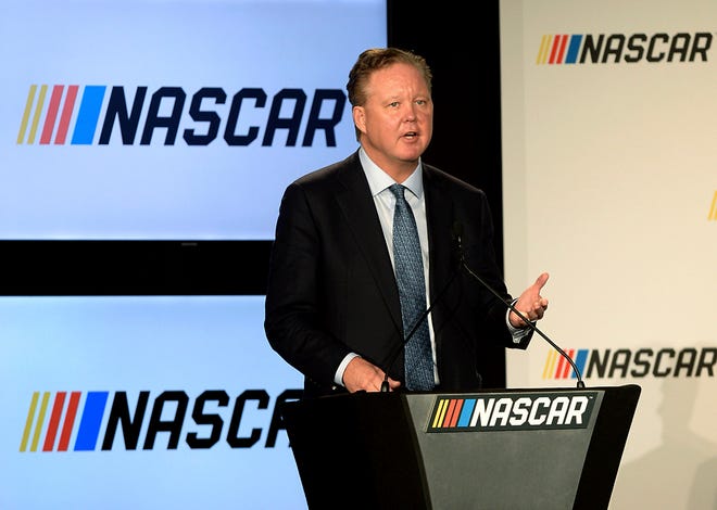 FILE - In this Jan. 23, 2017, file photo, Brian France, Chairman of NASCAR, gives opening remarks prior to an announcement of NASCAR's approach to modernizing its series with a new format, in Charlotte, N.C. NASCAR chairman Brian France has been arrested in New York's Hamptons for driving while intoxicated and criminal possession of oxycodone. France was arrested at 7:30 p.m. Sunday, Aug. 5, 2018, and held overnight. He was arraigned Monday at Sag Harbor Village Justice Court and released. (Jeff Siner/The Charlotte Observer via AP, File)