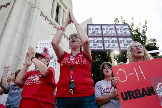 Supporters of Ohio State Buckeyes football coach Urban Meyer cheer during a rally in support of Meyer on Monday, August 6, 2018 at Ohio Stadium in Columbus, Ohio. Meyer is on paid administative leave while the university investigates Meyer's knowledge of a 2015 domestic abuse incident involving receivers coach Zach Smith and his now ex-wife Courtney Smith. (Joshua A. Bickel/Dispatch)