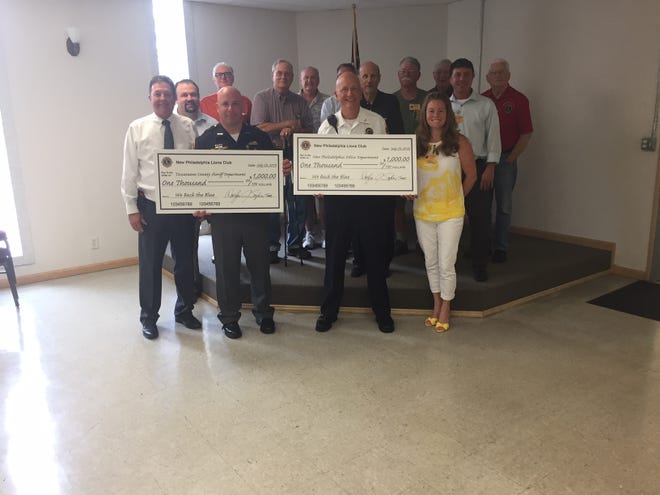 The New Philadelphia Lions Club recently made donations of $1,000 each to the New Philadelphia Police Department and the Tuscarawas County Sheriff’s Office. PHOTO PROVIDED
