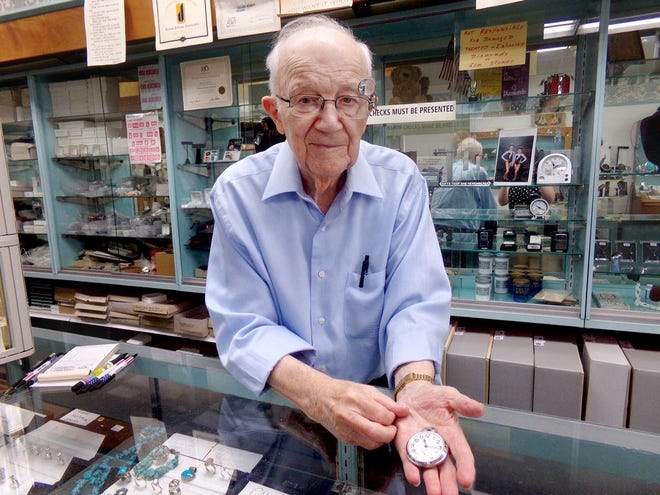 AMY GRETHEY/GATEHOUSE MEDIA ILLINOIS Ed Foster holds out a railroad watch. It's one of the unique items that Foster has been able to collect over his 67 years in the jewelry business.