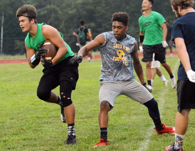 KILLINGLY 8-7-2018 Griswold's Devontae Fontaine intercepts the ball in front of Ledyard's Jahmik Devone Tuesday during the Passing League Championship in Killingly. [John Shishmanian/ NorwichBulletin.com]