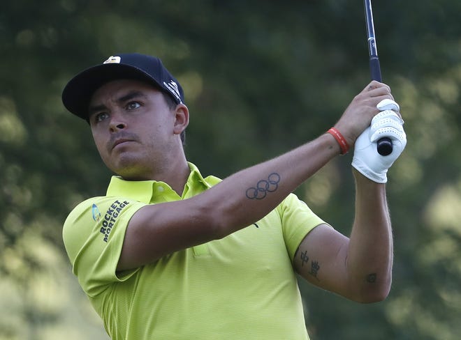 Rickie Fowler watches his tee shot on the 11th hole during the first round of the PGA Championship at Bellerive Country Club on Thursday in St. Louis. [Jeff Roberson/AP]