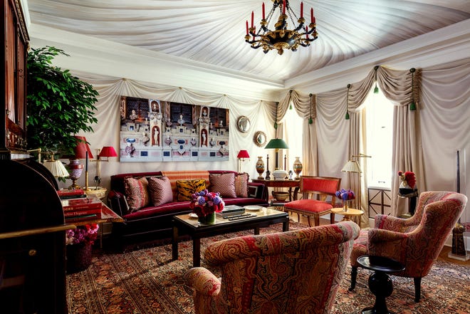 Alexa Hampton designed her show house space, "Olympia Folly," with a custom swagged paper by de Gournay for the walls; the ceiling mural is by Chuck Fischer. The trompe l'oeil swag on the walls perfectly melds into real swag draperies in Cowtan and Tout fabric. [NICKOLAS SARGENT VIA UNIVERSAL UCLICK]