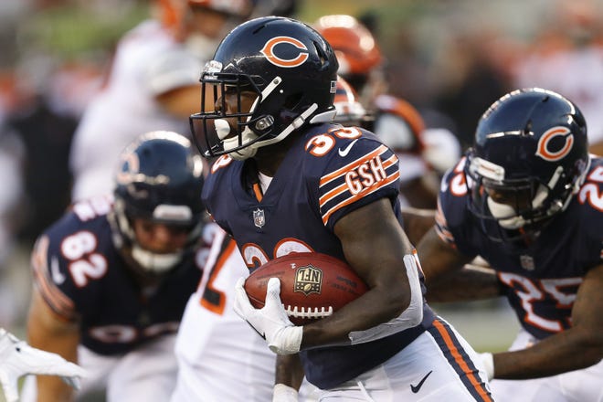 Chicago Bears running back Taquan Mizzell turns upfield during Thursday's 30-27 loss to the Cincinnati Bengals. [AP PHOTO]