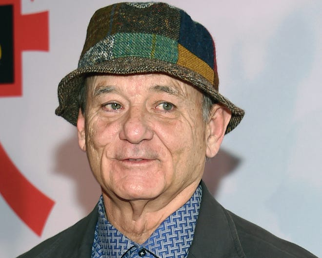 FILE - In this March 20, 2018, file photo, Bill Murray attends a special screening of "Isle of Dogs" at the Metropolitan Museum of Art in New York. Photographer Peter Simon, brother of Carly Simon, said actor Bill Murray slammed him against a door and poured a glass of water over him while he was making photos of a band Wednesday, Aug. 8, 2018, at a restaurant in Oak Bluffs, Mass., on the island of Martha's Vineyard. (Photo by Evan Agostini/Invision/AP, File)