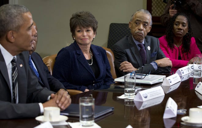 President Barack Obama speaks to the media at a meeting with civil rights leaders in the Roosevelt Room of the White House in Washington, Thursday, Feb. 18, 2016. From left are the president Rep, John Lewis, D-Ga., Senior White House Adviser Valerie Jarrett, Al Sharpton, Founder and President of the National Action Network, Sherrilyn Ifill, President of the NAACP Legal Defense Fund, and in the blue vest is Deray McKesson, Co-Founder of We the Protestors and Campaign Zero. (AP Photo/Carolyn Kaster)