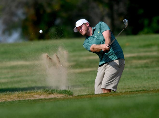 DAVID ZALAZNIK/JOURNAL STAR Ryan Brown lifts his ball out of a bunker Friday in the Peoria Men's City golf tournament semifinals.