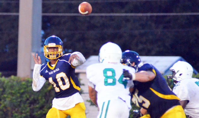 Winter Haven junior quarterback Eric Williams drills a pass under pressure from Haines City during a four-team preseason scrimmage on Friday at Lake Region. [BILL KEMP/THE LEDGER]