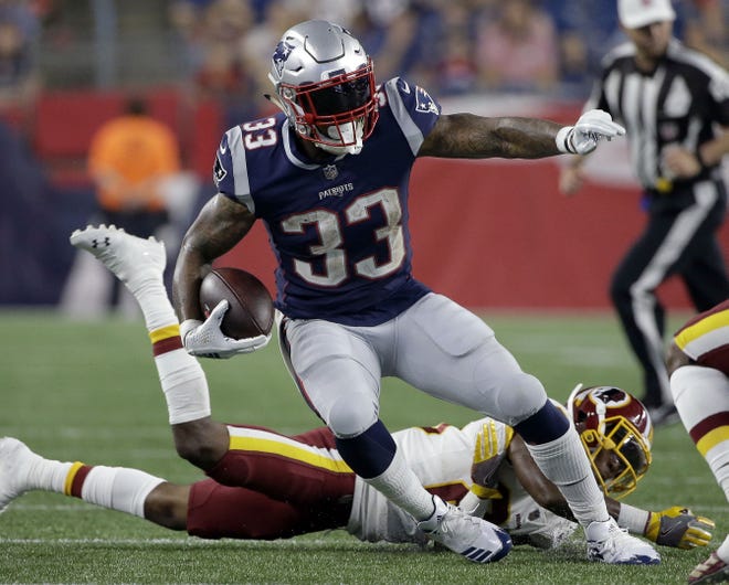 Patriots running back Jeremy Hill (33) gains yardage during second half of 26-17 comeback win against the Redskins in a preseason game on Thursday night in Foxborough. [AP Photo/Steven Senne]