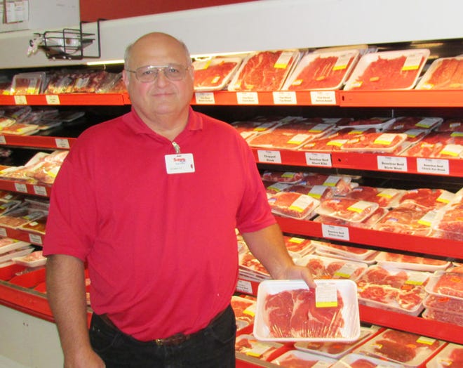 Everett Whitcher, owner of the Kewanee Save-A-Lot grocery store, shows off a point of pride – the store’s meat section – which offers fresh cuts seven days a week.