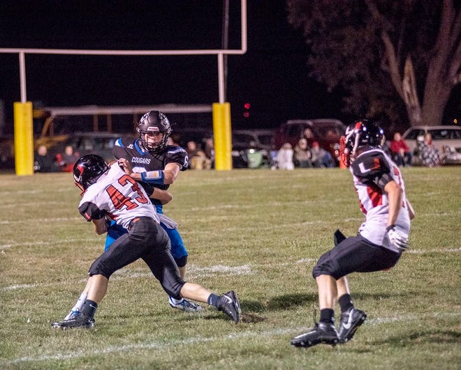 Mid-County quarterback Jacob Varner (6) tries to escape from a United defender last season.