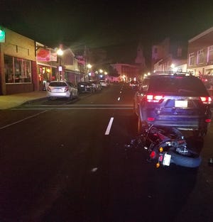 A crash occurred in downtown Rochester on Friday evening when a motorcyclist collided with the rear of an SUV that had stopped for a pedestrian in the crosswalk. [Photo courtesy of Rochester Police]
