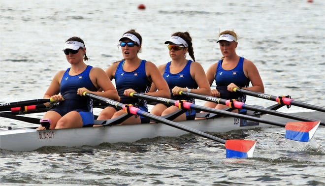 Rower Emmeline Laurence of Greenland, second from left, and her boatmates row in the warm-up queue before Saturday's semifinal race at the World Rowing Junior Championships in Racice, Czech Republic. [Courtesy]