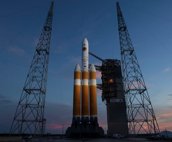 This photo provided by NASA shows the United Launch Alliance Delta IV Heavy rocket with the Parker Solar Probe onboard shortly after the Mobile Service Tower was rolled back, Friday, Aug. 10, 2018, Launch Complex 37 at Cape Canaveral Air Force Station in Cape Canaveral, Fla. NASA is sending a spacecraft straight into the sun's glittering crown, an atmospheric region so hot and harsh any normal visitor would wither. (Bill Ingalls/NASA via AP)