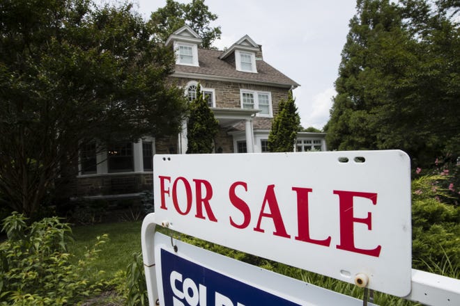 A for sale sign stands in front of a house. [AP Photo/Matt Rourke, File]