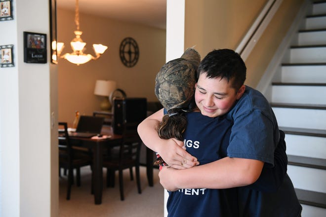 Kyle hugs Marianne Sheehan, a Vermont firefighter who has befriended Kyle and other students at Stoneman Douglas High. MUST CREDIT: Washington Post photo by Matt McClain.
