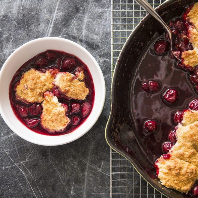 This cherry cobbler recipe appears in the cookbook "Cook It In Cast Iron." (Joe Keller/America's Test Kitchen via AP)