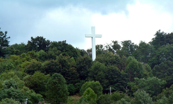 Overlooking Nelsonville is a cross that a local church member placed there in memory of his wife, Betty.