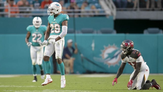 Miami Dolphins defensive back Minkah Fitzpatrick reacts to breaking up a pass at Hard Rock Stadium.