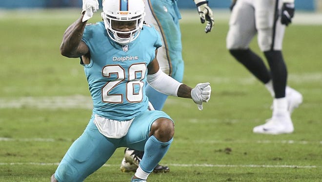 Miami Dolphins cornerback Bobby McCain (28) celebrates a defensive stop during the second half of the game between the Miami Dolphins and the Oakland Raiders at Hard Rock Stadium in Miami Gardens, Fla., on Sunday, November 5, 2017. Final score: Oakland Raiders, 27, Miami Dolphins, 24. (Andres Leiva / The Palm Beach Post)