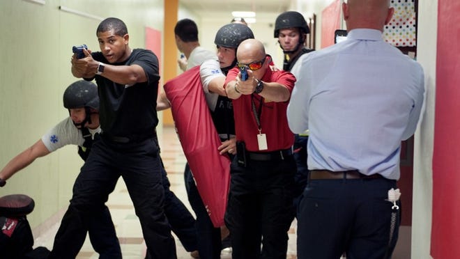 Members of Palm Beach Police and Palm Beach Fire Rescue train for active shooter at Palm Beach Public on Thursday July 19, 2018. (Meghan McCarthy / Daily News)