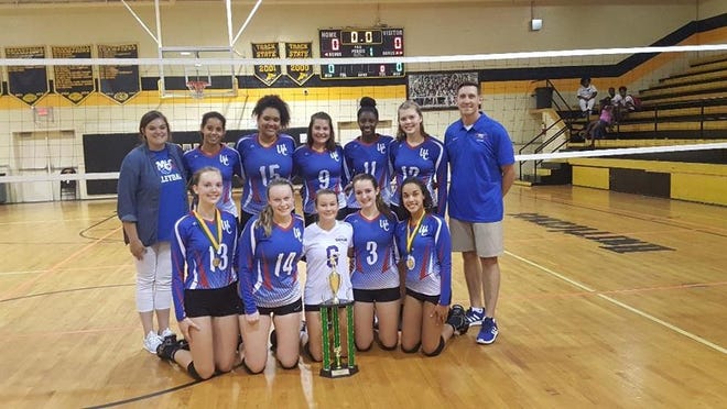 West Craven's volleyball team poses with its championship trophy from the "Beast of the East" volleyball tournament Saturday at Pamlico County. [CONTRIBUTED PHOTO]