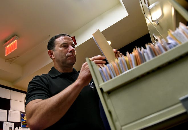 Riverside police Lt. Lou Fisher goes through files for NJTIP, which will now be launched in Mount Laurel. [ARCHIVE PHOTO]