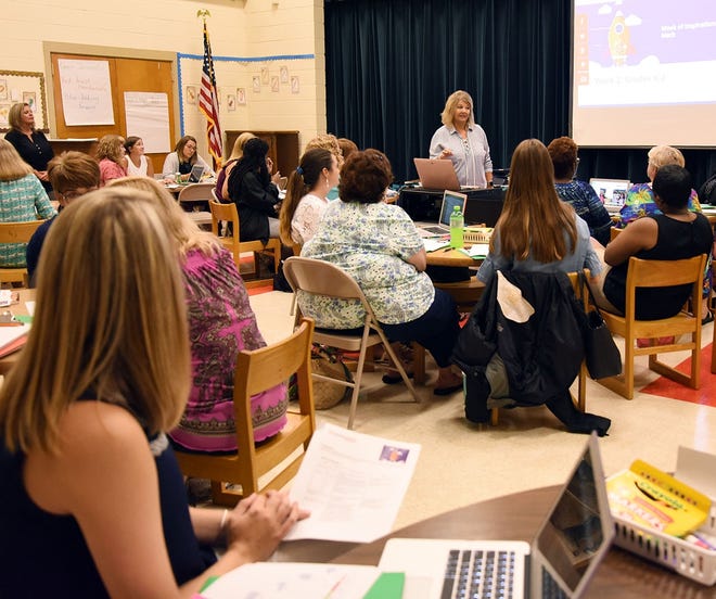 Robin Beaman, a first-grade teacher at Banks Elementary School, leads a math workshop for other first-grade teachers on Monday, the first day of a weeklong series of professional development workshops that begin the year under a revamped school calendar. [Submitted photo]