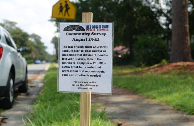 At the intersection of Dixon and Old Snow Hill on Tuesday there is a small sign announcing surveyors will be in the neighborhood at the end of the week. [Janet S. Carter / The Free Press]
