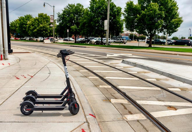 These Bird Ride Inc. electric scooters were for rent last week alongside the streetcar tracks in Bricktown. [Photo by Chris Landsberger, The Oklahoman]