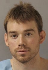 In this image released by the Metro Nashville Police Department, Travis Reinking poses for a booking photo on Monday, April 23, 2018, in Nashville, Tenn. The mentally unstable gunman suspected of killing four people in a late-night shooting at a Waffle House restaurant was arrested near his apartment Monday after hiding from police for more than a day, authorities said. (Metro Nashville Police Department via AP)