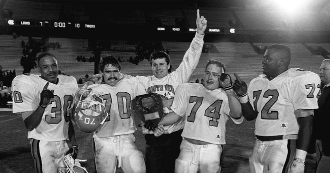 Coach Bobby Poss, with his winning South View team at the NCHSAA 4-A state football finals on Dec. 14, 1991. [Staff file photo/The Fayetteville Observer]