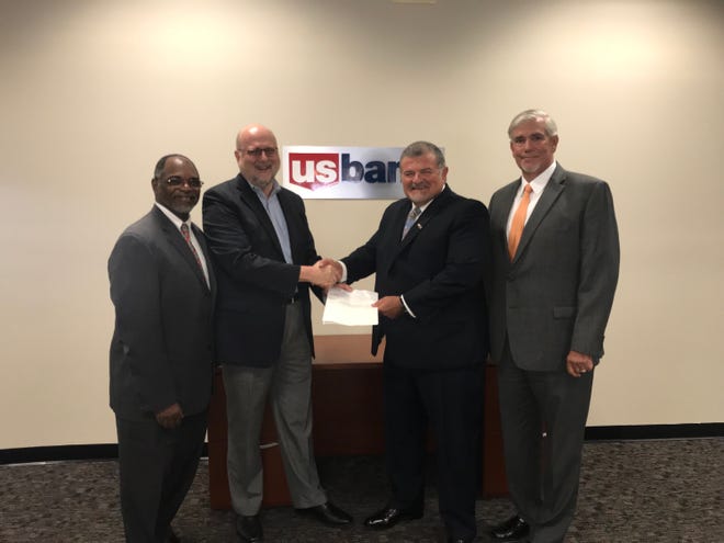 Appalachian Growth Capital, a subsidiary of Appalachian Partnership Inc., recently announced that U.S. Bank awarded the organization a grant of $37,500. Pictured, from left: Jeffery Mills, of U.S. Bank; John Molinaro, of API.; Jeff East, of U.S. Bank; and AGC President and CEO Brad Blair. PHOTO PROVIDED