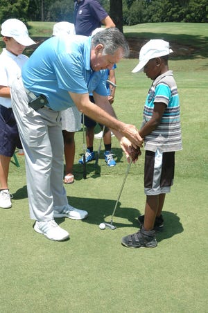 For several weeks in July, the First Tee of the Lowcountry hosted golf clinics at Sgt. Jasper Golf Course in Ridgeland. The sessions averaged about 14 kids per class. Instructor Bob Valentino offers guidance during a session at Hidden Cypress golf course. [Anthony Garzilli/Jasper County Sun Times]