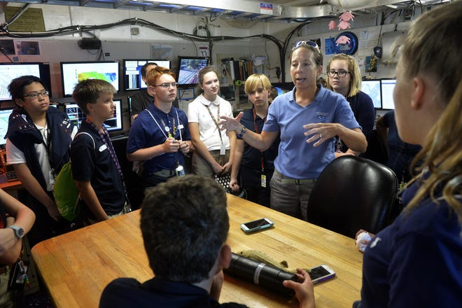 Chief scientist Kimberly Roberson, center, gives an overview of her research at Gray's Reef National Marine Sanctuary to students from Coastal Middle School as they tour the NOAA ship Nancy Foster. [Steve Bisson/Savannah Morning News]