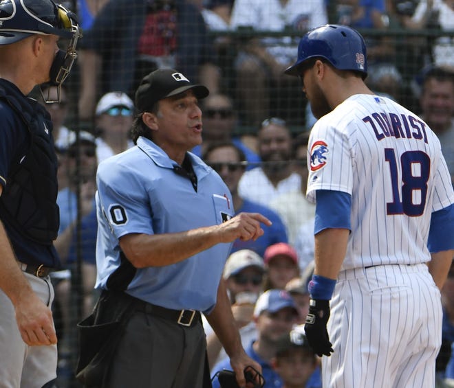 Chicago Cubs' Ben Zobrist (18) argues a strike call with umpire Phil Cuzzi (10) during the sixth inning of a baseball game, Tuesday, Aug. 14, 2018, in Chicago. (AP Photo/David Banks)