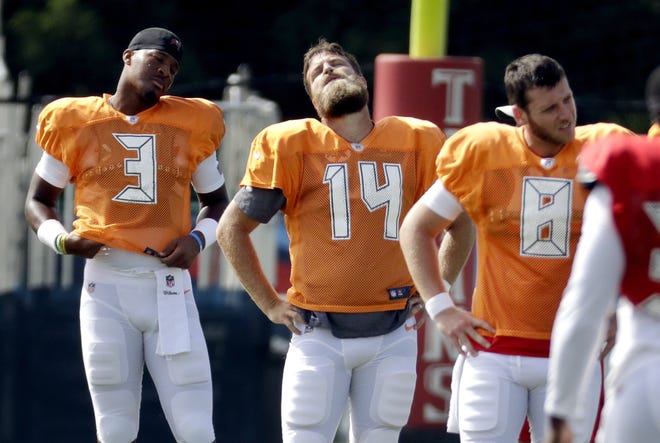 Tampa Bay Buccaneers quarterbacks Jameis Winston (3), Ryan Fitzpatrick (14) and Austin Allen (8) stretch during a combined NFL football training camp with the Tennessee Titans Wednesday in Nashville, Tenn. [MARK HUMPHREY/THE ASSOCIATED PRESS]