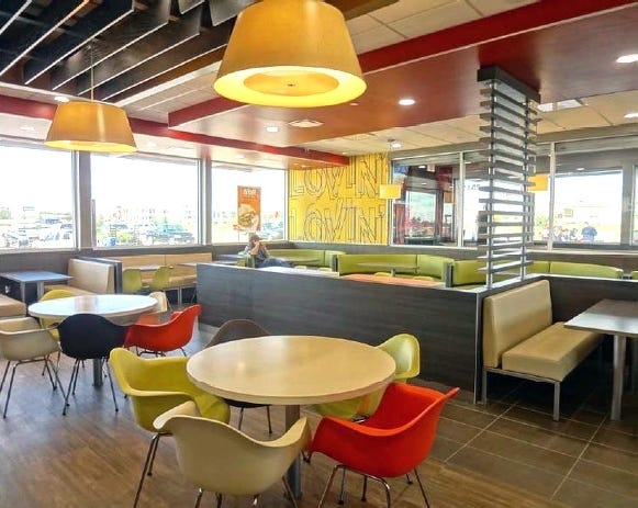 The new McDonald's interior design features bight colors and sleek shapes. [PROVIDED PHOTO]