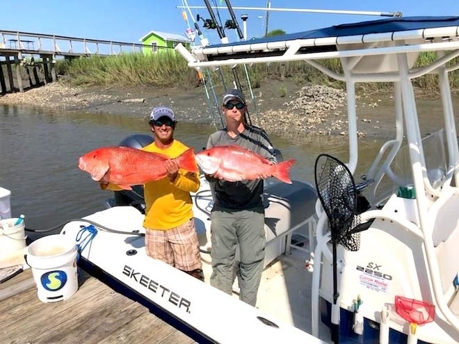 Capt. Jimmy Armel (left) and Wilmington Island resident Bret Baker show their catch of red snapper from last weekend. [American Fishing Charter]