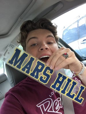 Thorne Blancher shows a window sticker that he bought during a recent visit to Mars Hill University, where he will attend on a full-ride scholarship this fall. [THORNE BLANCHER/SPECIAL TO THE GASTON GAZETTE]