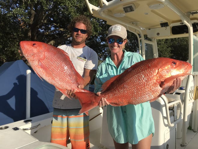 Kimzey Slade, right, schooled the boys last weekend, prying the biggest red snapper off the bottom both Friday and Saturday. She’s shown here with her pretty fish and a not-so-pretty boyfriend, Jordan John. Not to kick a guy when he’s down, but that’s her Everglades too. [JIM SUTTON/THE RECORD]