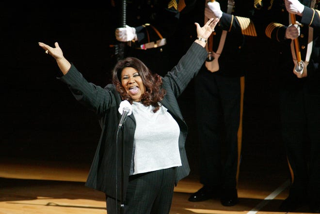 Singer Aretha Franklin sings the National Anthem before the start of game 5 of the NBA Finals between the Detroit Pistons and the Los Angeles Lakers at the Palace of Auburn Hills, Mich., Tuesday, June 15, 2004. (AP Photo/Al Goldis)