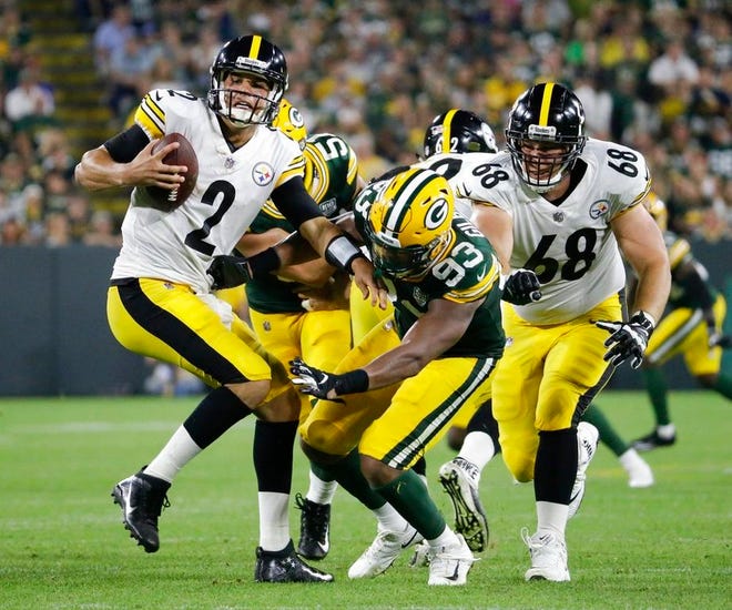 Green Bay Packers' Reggie Gilbert sacks Pittsburgh Steelers quarterback Mason Rudolph during the first half of a preseason NFL football game Thursday, Aug. 16, 2018, in Green Bay, Wis. (AP Photo/Mike Roemer)