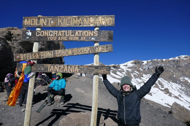 Laurel Erickson stands atop Mount Kilimanjaro, the tallest mountain in Africa. [COURTESY OF LAUREL ERICKSON]